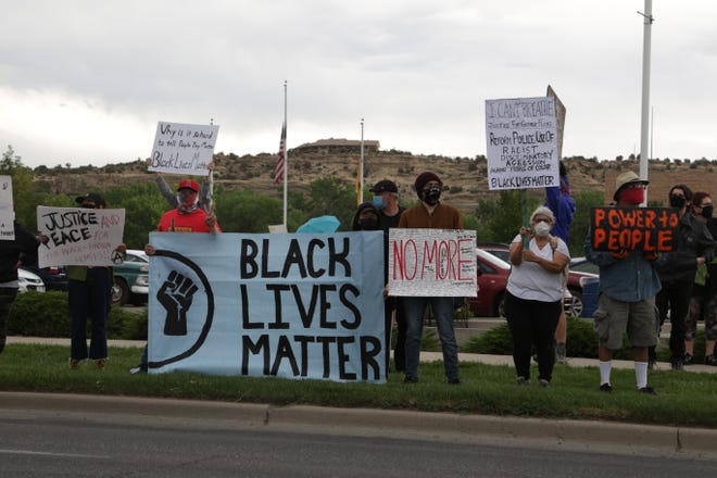 Several people demonstrate peacefully at a Black Lives Matter protest in front of the Farmington Museum at Gateway Park on June 5 in Farmington.