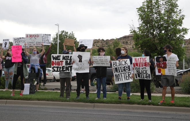 Dozens demonstrate peacefully at a Black Lives Matter protest in front of the Farmington Museum at Gateway Park on June 5 in Farmington.