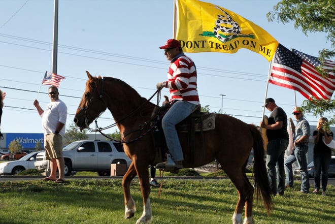 Rocco Dipaolo rides his mare, Bonita, during a rally demonstrating support for law enforcement, Friday, June 19, 2020, at the Animas Valley Mall.