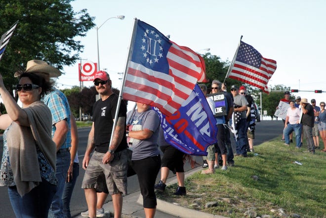 A crowd gathered in front of Animas Valley Mall, Friday, June 19, 2020, to show support for law enforcement in Farmington.