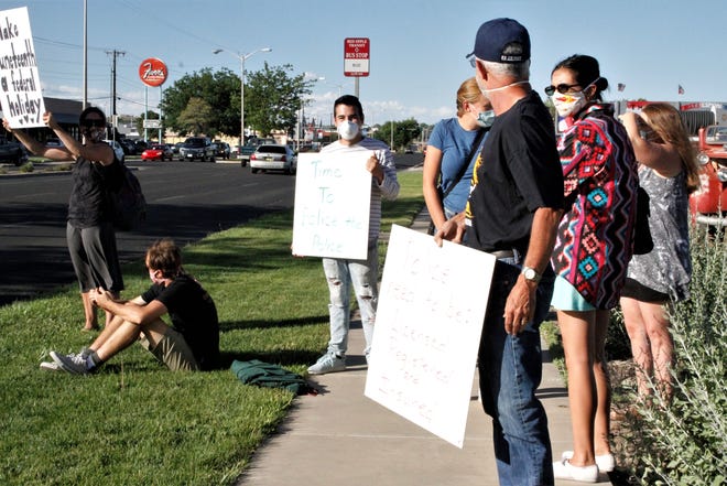 Protesters gather, Friday, June 19, 2020, at Farmington Museum at Gateway Park.