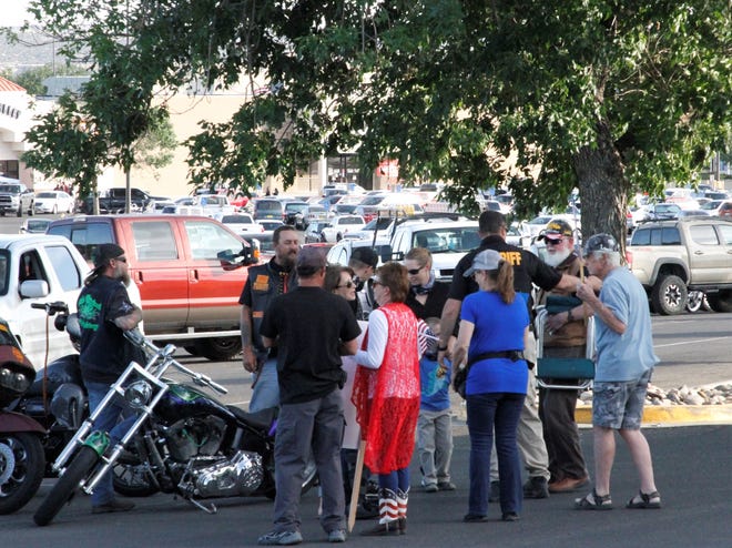 Demonstrators greet Sheriff Shane Ferrari as he arrives at a rally showing support for law enforcement, Friday, June 19, 2020, at the Animas Valley Mall in Farmington.