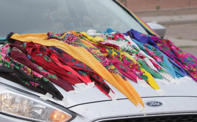 A rainbow of scarves decorates a car in the Din é Pride Cruise on June 26 in Window Rock, Arizona.