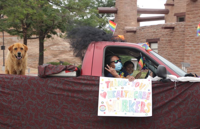 Jody Lynch, center, and Julie Lynch participate in the Diné Pride Cruise on June 26 in Window Rock, Arizona.