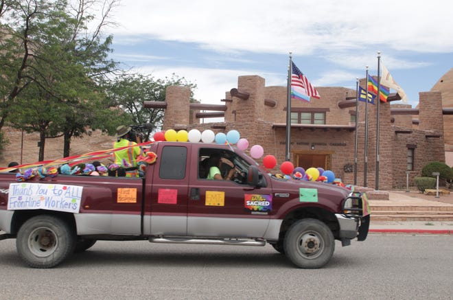 Participants in the Diné Pride Cruise on June 26 pass the Navajo Nation Council chamber in Window Rock, Arizona.