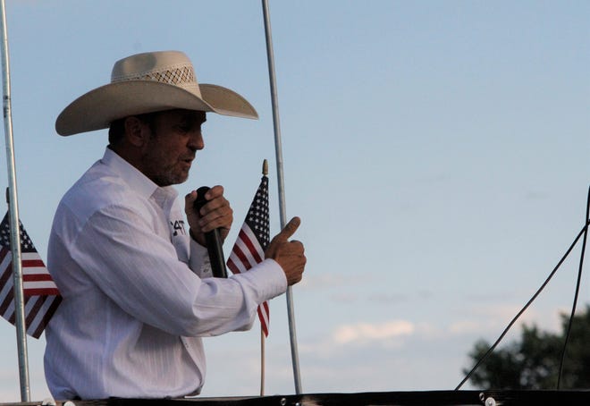 Cowboys for Trump founder Couy Griffin speaks, Friday, July 11, 2020, as part of the Freedom March in Farmington.