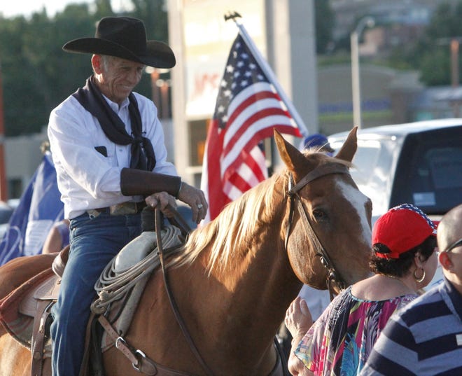 Ramie Harper sits on his horse, Saturday, July 11, 2020, during the Freedom March.