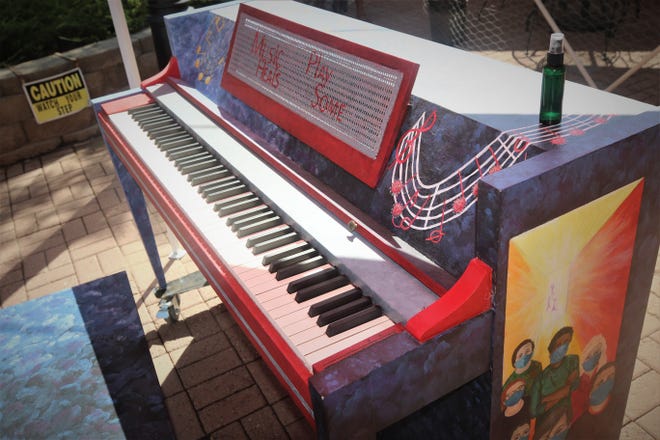 Artist Bonnie Adams chose to focus on the healing power of music as the theme for the piano she painted.