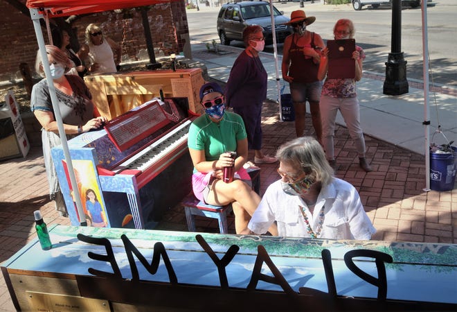 Hoyle Osborne performs for the crowd on Aug. 15, 2020, in Aztec's Main Avenue Plaza during an introductory event for the town's Painted Pianos -- Big Sound in a Small Town project.