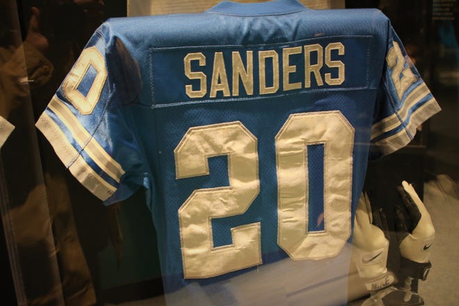 A jersey and gloves worn by Detroit Lions Hall of Fame running back Barry Sanders is included in the "Gridiron Glory" exhibition at the Farmington Museum at Gateway Park.