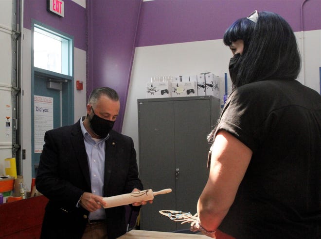 SBA Regional Administrator Justin Crossie looks at an item made at the San Juan College Makers Space during a tour, Wednesday, Sept. 16, 2020, in Farmington.