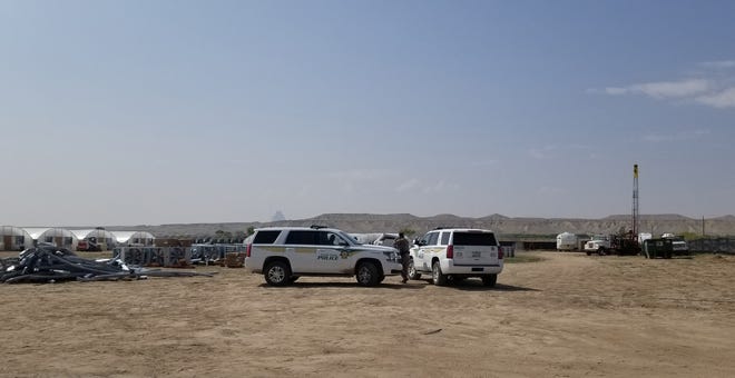 The Navajo Police Department visit a hemp farm in Shiprock on Sept. 19 to enforce the court order to stop cultivation of the plant.