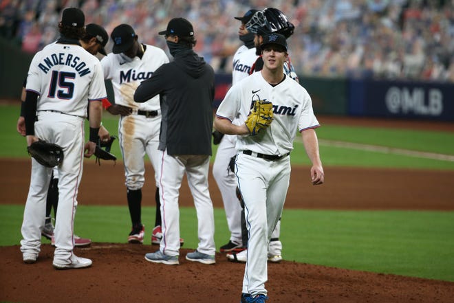 Oct 8, 2020; Houston, Texas, USA; Miami Marlins starting pitcher Trevor Rogers (right) leaves the mound during the fifth inning of game three of the 2020 NLDS against the Atlanta Braves at Minute Maid Park. Mandatory Credit: Troy Taormina-USA TODAY Sports