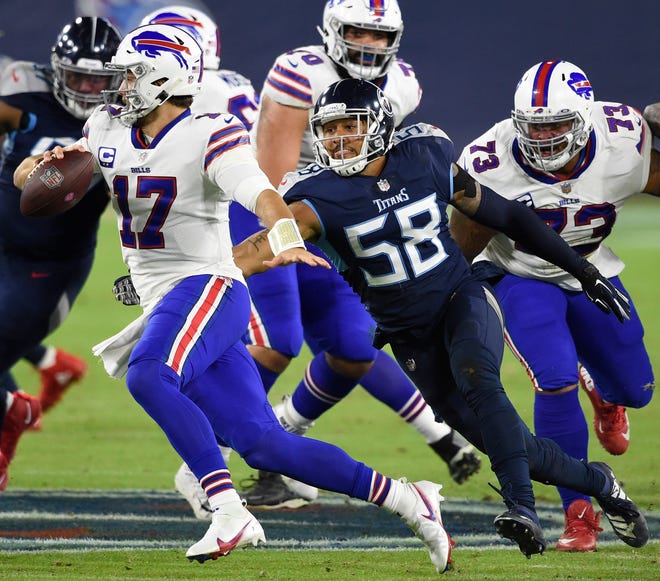 Tennessee Titans outside linebacker Harold Landry (58) chases down Buffalo Bills quarterback Josh Allen for a sack.