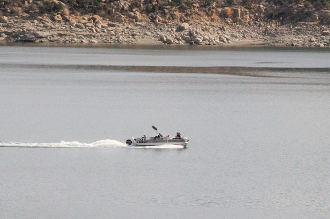 A boat is pictured, Friday, Nov. 6, 2020, on Navajo Lake.