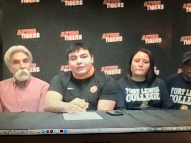 Aztec’s Caleb Varzeas signs his National letter of intent via Zoom on Wednesday, Feb. 3, 2021, to continue his football career at NCAA Division II Fort Lewis College.