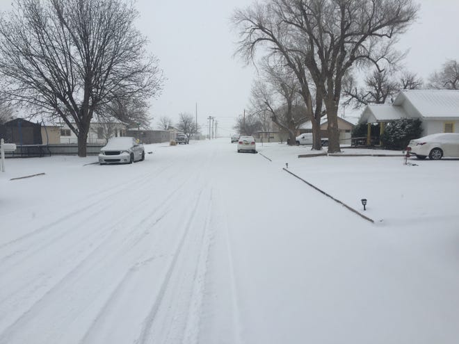 Snow covered an Artesia neighborhood on Valentine's Day. The New Mexico Public Regulation Commission is asking utilities for information about the impacts the storm had on costs and could have on ratepayers.