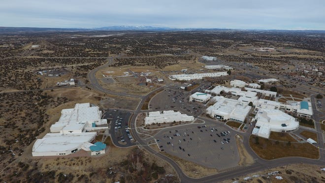 An aerial view of the San Juan College campus in Farmington is featured. The college's new residential student facility will be built north of the Health and Human Performance Center, which is the large white building at left.