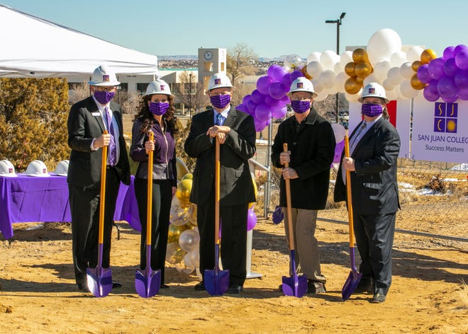 Boomer Appleman, vice president for student services, left; Toni Hopper Pendergrass, president; Joseph Rasor, chairman of the San Juan College Board of Trustees; Chris Harrelson, senior director of the physical plant; and Edward DesPlas, executive vice president, take part in a groundbreaking ceremony Feb. 19, 2021, for a new student housing project on the college campus in Farmington.