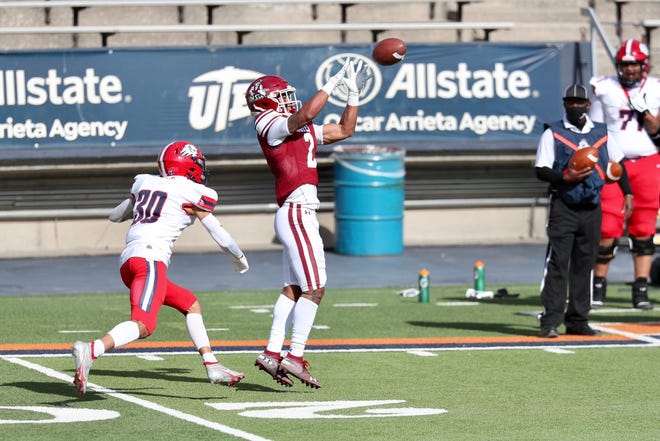 Isaiah Garcia-Castaneda (2) receives as New Mexico State takes on Dixie State at the Sun Bowl in El Paso, Texas on Sunday, March 7, 2021.