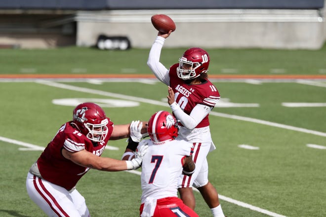 Jonah Johnson (10) passes as New Mexico State takes on Dixie State at the Sun Bowl in El Paso, Texas on Sunday, March 7, 2021.