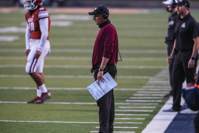 Head coach Doug Martin stands on the sidelines as the New Mexico State Aggies face off against the Dixie State Trailblazers at UTEP’s Sun Bowl in El Paso on Sunday, March 7, 2021.