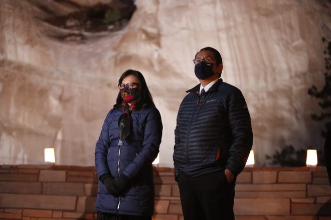 Navajo Nation President Jonathan Nez, right, and first lady Phefelia Nez pay tribute to the 1,222 tribal members who died of COVID-19 in an event on March 17 in Window Rock, Arizona.