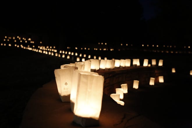 Navajo Nation Office of the President and Vice President employees and volunteers set up 1,222 luminaries on March 17 at Veterans Memorial Park in Window Rock, Arizona to remember tribal members who died of COVID-19.