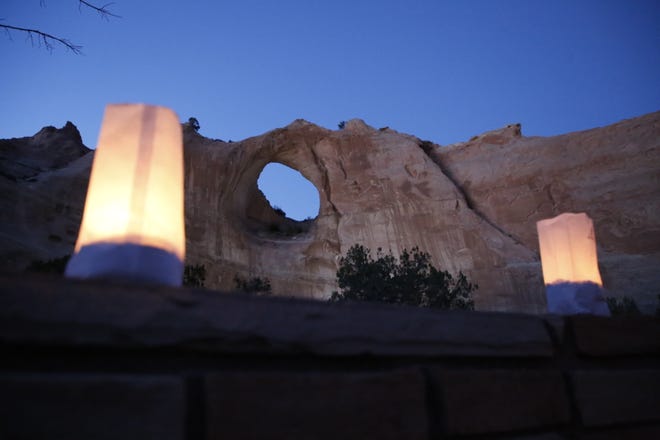 The Window Rock formation is seen on March 17 during an event to remember members of the Navajo Nation who died of COVID-19.