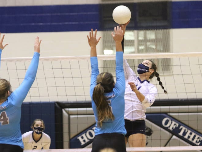 Piedra Vista's Bailey Rasmussen hits the ball over for a kill against Cleveland in the 5A volleyball state quarterfinals on Tuesday, March 30, 2021, at Jerry A. Conner Fieldhouse in Farmington.