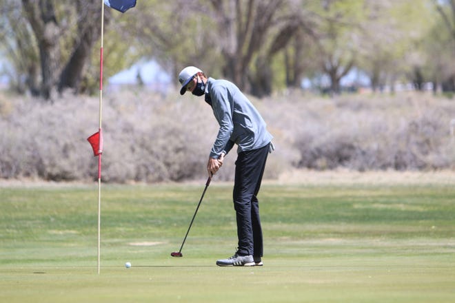 Piedra Vista's Quinn Yost putts on the ninth green during the Aztec Invitational on Monday, April 19, 2021, at Riverview Golf Course in Kirtland.