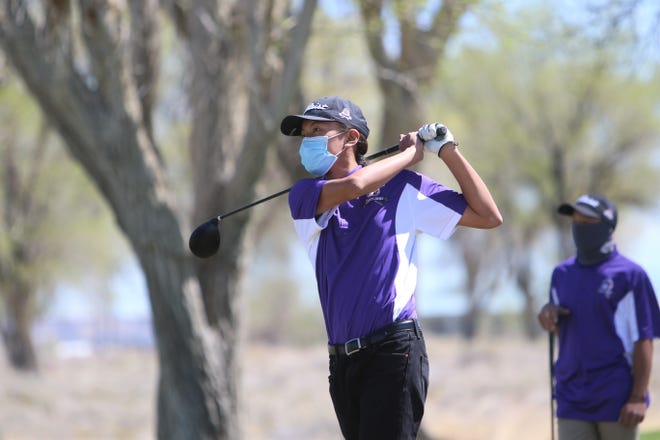 Kirtland Central’s Noah Dineyazhe watches his ball soar into the distance from the ninth tee box during the Aztec Invitational on Monday, April 19, 2021, at Riverview Golf Course in Kirtland.