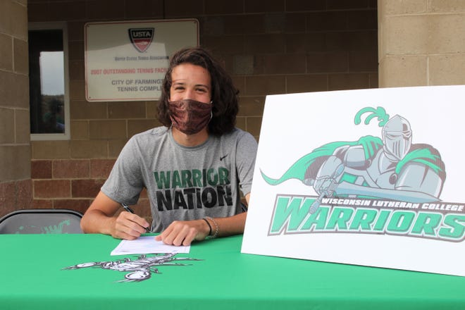 Farmington's Asa White signs his National Letter of Intent on Monday, May 3, 2021, to continue his tennis career at NCAA Division III Wisconsin Lutheran College.