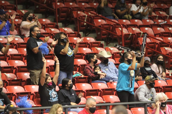 Navajo Prep fans cheer on the team during the 3A state girls basketball finals on Friday, May 7, 2021, at The Pit in Albuquerque.