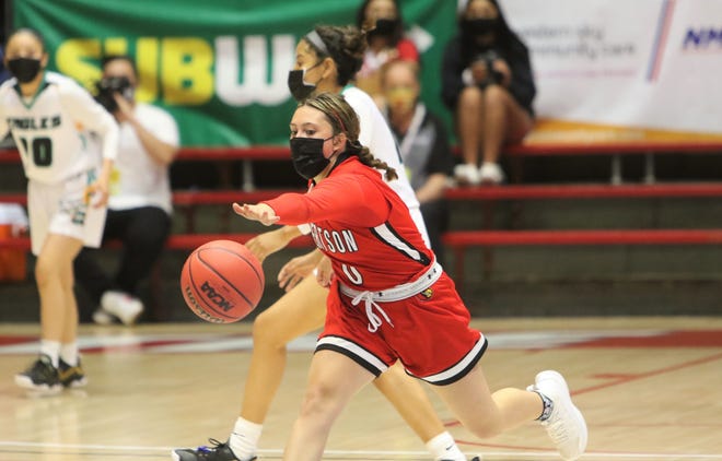 Robertson's Azlyn Padilla tries to keep the ball in play against Navajo Prep during the 3A state girls basketball finals on Friday, May 7, 2021, at The Pit in Albuquerque.