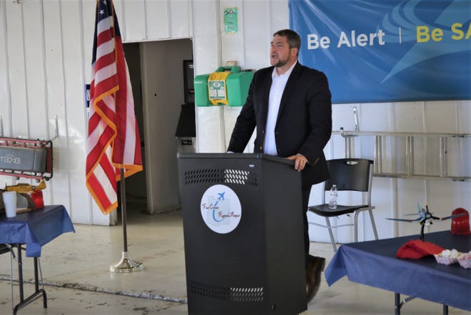 Ryan Waguespack, senior vice president of the National Air Transportation Association, addresses a small crowd in an Atlantic Aviation hangar at Farmington's Four Corners Regional Airport on May 6, 2021.