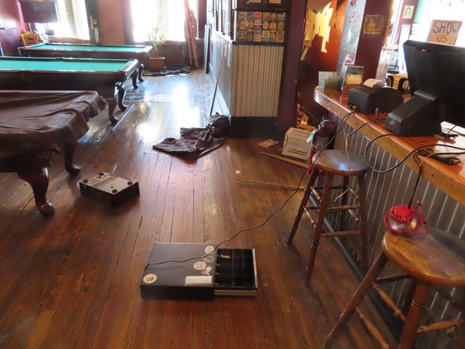 Several objects were thrown to the floor during a burglary early Monday at the Three Rivers Tap & Game Room in downtown Farmington.