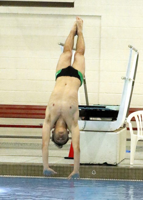 Farmington's Eddie Durphy dives at the 2021 NMAA Swimming & Diving Championships at Albuquerque Academy on May 15, 2021. Durphy came in second place with 449.85 points.