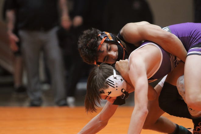 Aztec's Bryson Valdez locks up Miyamura's Rhys Sellers in the 106-pound championship match during the District 1-4A wrestling championships on Saturday, May 22, 2021, at Lillywhite Gym in Aztec.