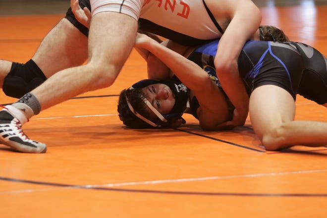 Bloomfield's Diego Snell-Martinez looks to free himself against Aztec's Tony Thompson in the 145-pound championship match during the District 1-4A wrestling championships on Saturday, May 22, 2021, at Lillywhite Gym in Aztec.