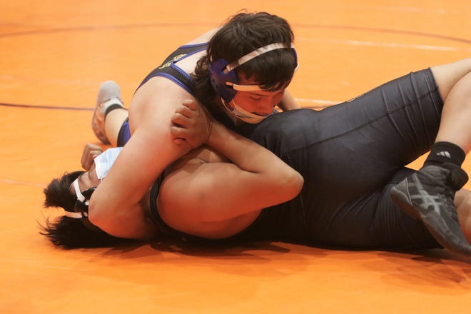 Bloomfield's Augustine Aguilar locks up Kirtland Central's Payton Watchman in the 195-pound third place match during the District 1-4A wrestling championships on Saturday, May 22, 2021, at Lillywhite Gym in Aztec.