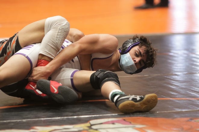 Miyamura's Hunter Gonzales tries to regain control against Gallup's Joseph Baca in the 120-pound division third place match during the District 1-4A wrestling championships on Saturday, May 22, 2021, at Lillywhite Gym in Aztec.