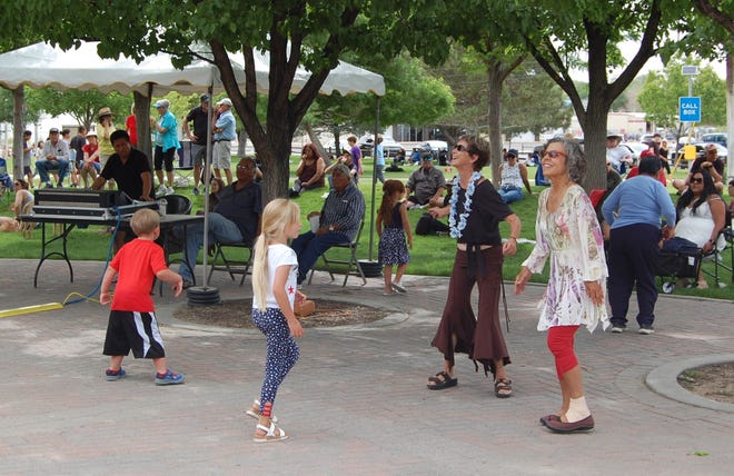 Visitors to the inaugural Animas River Jam dance to the music of the Fetz X-tet May 29, 2021, at the River Reach Terrace in Berg Park in Farmington.