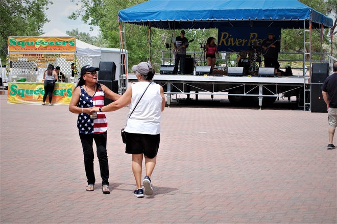 Visitors to the inaugural Animas River Jam dance to the music of Julie & the Boyz on May 29, 2021, at the Rocky Reach Landing stage in Animas Park in Farmington.