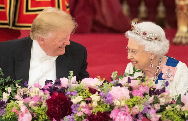 Queen Elizabeth II laughs with President Donald Trump during a state banquet in his honor in the ballroom at Buckingham Palace on June 3, 2019, on the first day of a three-day visit by the president and first lady Melania Trump.