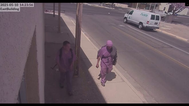 Brian Benally, left, walks with an unidentified man in video surveillance footage from May 10 from a Farmington Police Department produced video released on June 9. Law enforcement released a video depicting the alleged events where Benally allegedly fired a gun more than 24 times in downtown Farmington, before he was shot by police in the 100 block of West Animas Street.