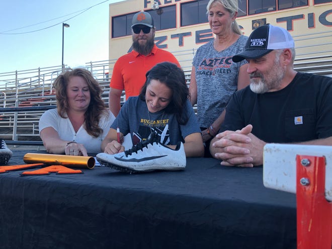 Aztec’s Helen Moore signs her national letter of intent on Tuesday, June 8, 2021, to continue her track and field career at NAIA’s Park University.
