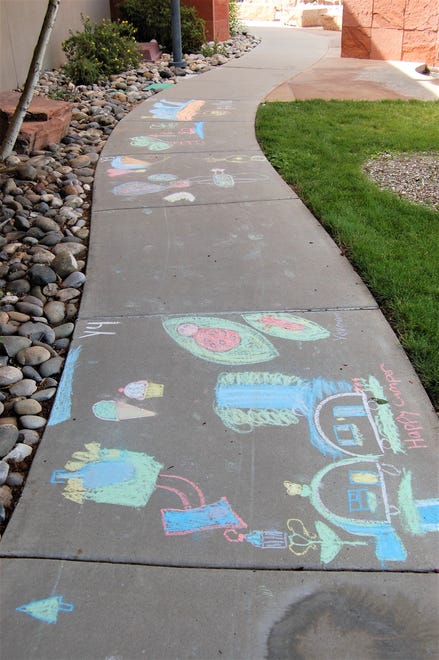 Several entries in the Farmington Public Library's Chalk Art Festival are pictured on the east side of the library on June 10.
