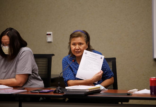 Shiprock Chapter President Nevina Kinlahcheeny shows the project list that chapter officials want funded by the amount the Navajo Nation received under the American Rescue Plan Act during a discussion with tribal officials on June 10 in Shiprock.