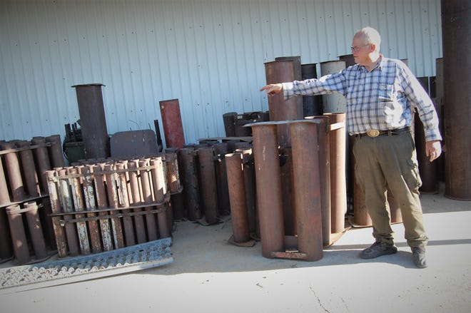 B-Square Ranch owner Tommy Bolack points out the different sizes of the mortar tubes he will use in his annual Fourth of July fireworks show.